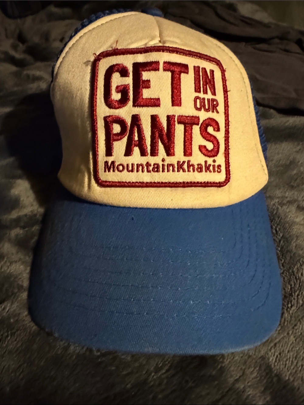 Mountain Khakis Blue and Cream Trucker Hat with Red Patch